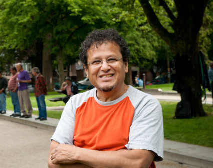 Man standing near bocce court